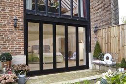 After customer testimonial of black aluminium bifold doors from Anglian Home Improvements