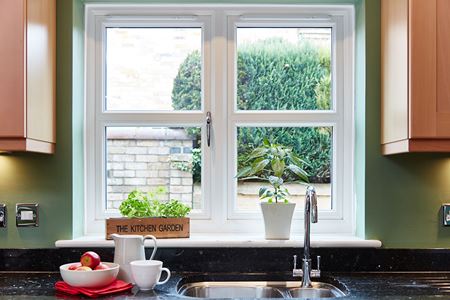 White UPVC casement window with double glazing and Georgian bars from the Anglian UPVC window range