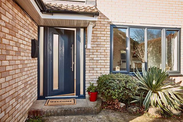 Black composite front door with frosted glass side panels