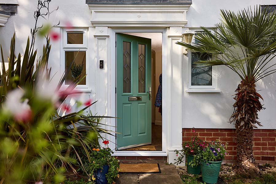 Classic winchester composite door in dual sage green with bevelled etched glass