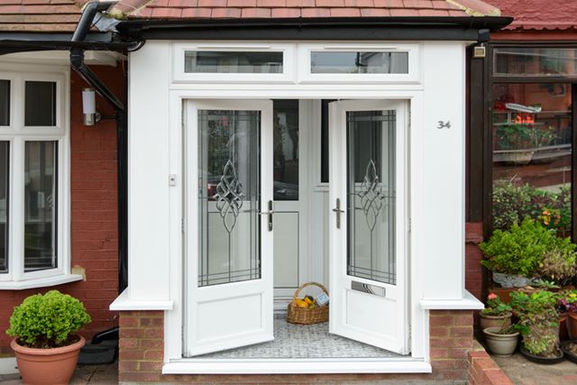 Double white porch doors with bevelled glass panels