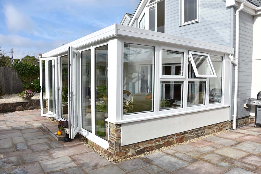 White uPVC orangery with french doors