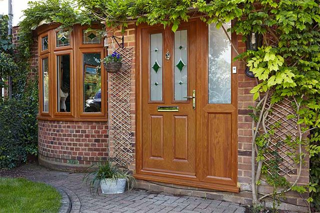 Golden oak uPVC front door with etched and coloured glass panel