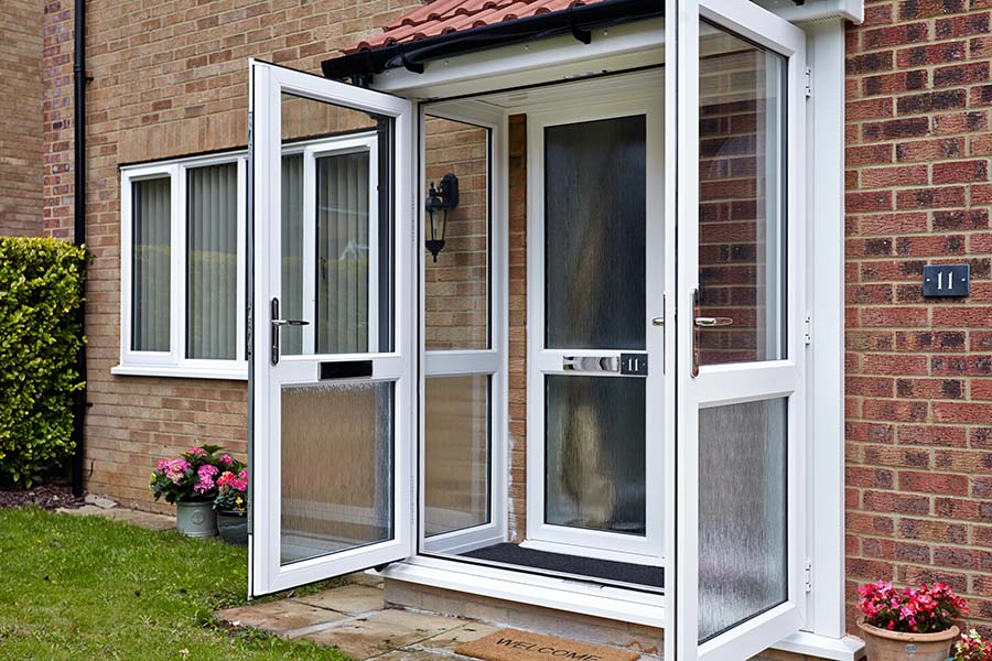 White uPVC porch and front door with frosted glass